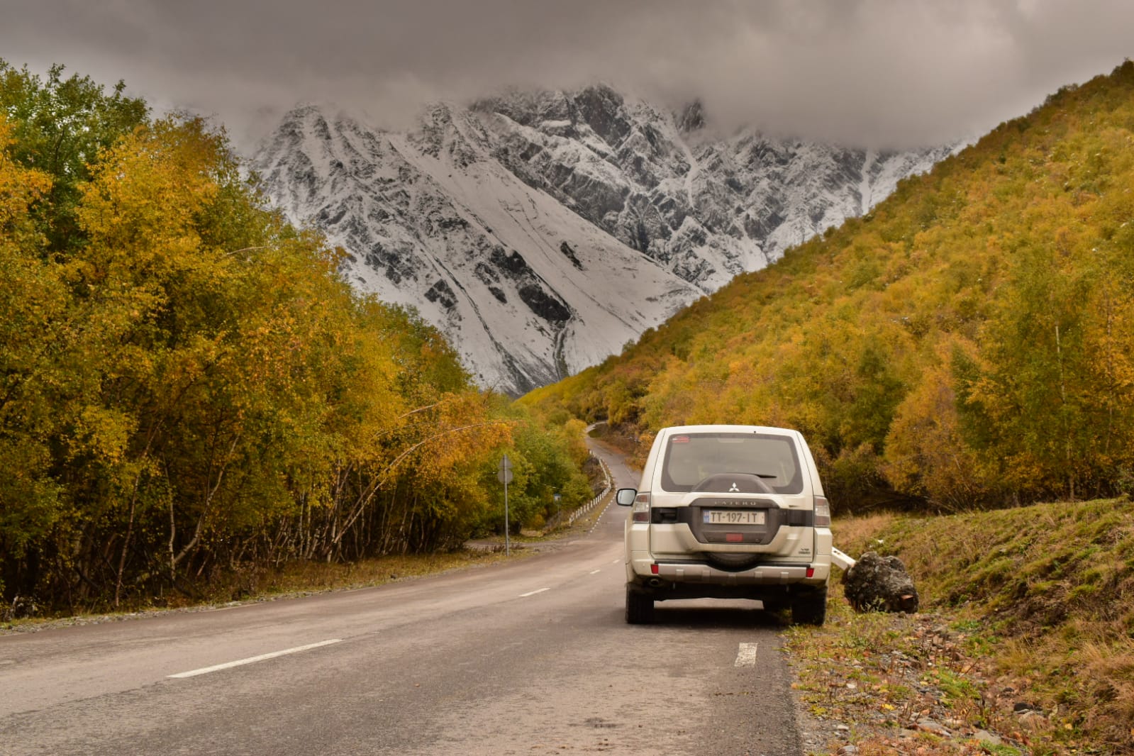 Kakheti wine region by car: a rental SUV on an autumn road